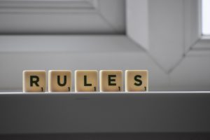 Scrabble tiles spelling the word rules